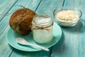 Coconut oil and protein with fresh coconuts Royalty Free Stock Photo