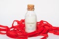 Coconut oil with red ribbon on a white background Royalty Free Stock Photo
