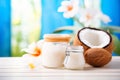 coconut oil scrub in a jar with fresh coconuts nearby Royalty Free Stock Photo