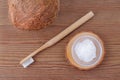 Coconut oil toothpaste, natural alternative for healthy teeth, wooden toothbrush, above Royalty Free Stock Photo