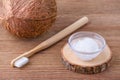 Coconut oil toothpaste, natural alternative for healthy teeth, wooden toothbrush Royalty Free Stock Photo