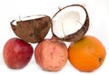 Coconut orange pomegranate apple on white background Royalty Free Stock Photo
