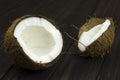 Coconut pulp fresh tropical brown white organic coconut milk on wooden black background