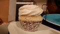 A fresh coconut raspberry cupcake