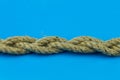 Coconut rope binding of three pieces on a blue background is horizontal Royalty Free Stock Photo