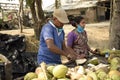 coconut seller preparing coconut to sell at frezargunj , westbengal, india