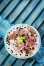 Coconut sorbet with raspberry sauce and chocolate