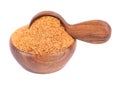 Coconut sugar isolated on white background. Brown unrefined coconut palm sugar in wooden bowl and spoon.