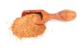 Coconut sugar isolated on white background. Brown unrefined coconut palm sugar in wooden scoop.