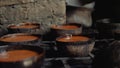 Coconut sugar made from neera or coconut nectar solidifying in coconut shells