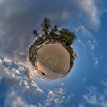 coconut trees in jungle in Indian tropic village on sea shore on little planet in blue sky, transformation of spherical 360 Royalty Free Stock Photo