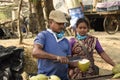 coconut vendor family selling coconut to the visitors at Frezargunj Harbor site, West Bengal, India