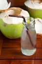 Coconut water drink on wood table Royalty Free Stock Photo