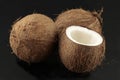 Coconuts on black background