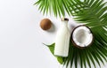 coconuts and coconut oil with tropical leaves onwhite bathroom background