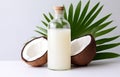 coconuts and coconut oil with tropical leaves onwhite bathroom background