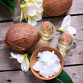 Coconuts and coconut oil on vintage wooden background. Royalty Free Stock Photo