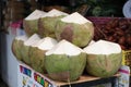 Coconuts on a market stall prepared for sale Royalty Free Stock Photo