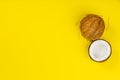 Coconuts on yellow background Royalty Free Stock Photo