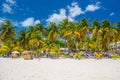 Cocos beach bar on a beach with white sand and palms on a sunny day, Isla Mujeres island, Caribbean Sea, Cancun, Yucatan, Mexico Royalty Free Stock Photo