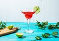 Coctail margarita with lime on blue wood background