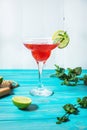 Coctail margarita with lime on blue wood background