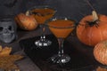 Coctail Pumpkintini of pumpkin and martini with black sugar rim for Halloween parties or Thanksgiving Day