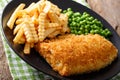 Cod Fish and chips with green peas close-up on a plate. horizontal Royalty Free Stock Photo