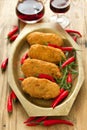 Cod fish croquettes with pepper on dish Royalty Free Stock Photo