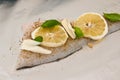 Cod fish dish with lemons and tomatoes