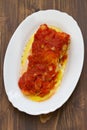 Cod fish with tomato sauce on white dish Royalty Free Stock Photo