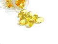 Cod liver oil or fish oil gel capsules on white background Royalty Free Stock Photo