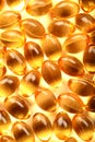 Cod-liver oil macro image of health capsules. Royalty Free Stock Photo