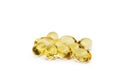 Cod liver oil omega 3 gel capsules or pils isolated on a white background. A group of transparent fish oil tablets.