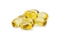 Cod liver oil omega 3 gel capsules or pils isolated on a white background. A group of transparent fish oil tablets.