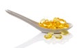 Cod liver oil omega 3 gel capsules in spoon Royalty Free Stock Photo