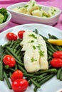 Cod loins with beans and tomato