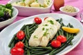 Cod loins with beans and tomato