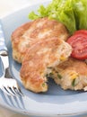 Cod and Salmon Fish Cakes with Corn and Salad Royalty Free Stock Photo