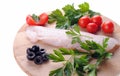 Cod steak with tomatoes olives and parsley