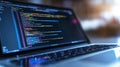 Code Development on a Laptop Displaying Complex Data Strings, Reflecting Modern Programming Stages Royalty Free Stock Photo