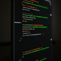 Code displayed on a computer screen with multicolored syntax highlighting. The text Royalty Free Stock Photo