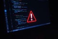 Code error alert showing on a computer screen at night Royalty Free Stock Photo
