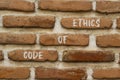 Code of ethics symbol. Concept words Code of ethics on brick wall. Beautiful brick wall background. Business ethic and code of