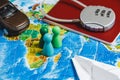 Code Lock on Red Passport, Toy Car, Men, Papercraft Plane on World Map Background. Concept-Ban on Travel, Lack of Visa.