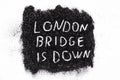 It is code name of the operation when the Queen of the England die written on the black glitter - LONDON BRIDGE IS DOWN Royalty Free Stock Photo