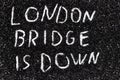 It is code name of the operation when the Queen of the England die written on the black glitter - LONDON BRIDGE IS DOWN Royalty Free Stock Photo