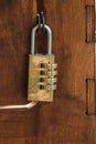 Code padlock on wooden small door Royalty Free Stock Photo