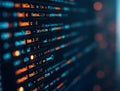 Code snippet on dark background showcases programming syntax and digital technology elements in a modern workspace setting Royalty Free Stock Photo