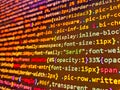 Screen of web developing php code on dark background. Coworkers team in modern office. Royalty Free Stock Photo
